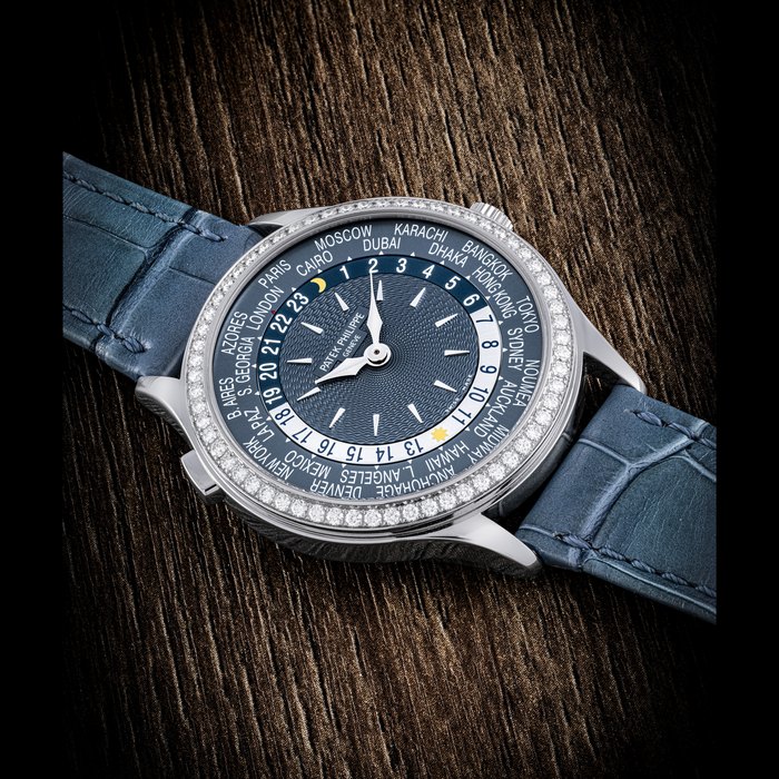 PATEK PHILIPPE. A LADY'S ATTRACTIVE 18K WHITE GOLD AND DIAMOND-SET AUTOMATIC WORLD TIME WRISTWATCH REF.7130G-014, CIRCA 2017