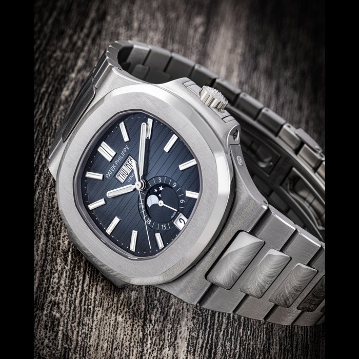 PATEK PHILIPPE. A STAINLESS STEEL AUTOMATIC ANNUAL CALENDAR WRISTWATCH WITH SWEEP CENTRE SECONDS, MOON PHASES, 24 HOUR INDICATION AND BRACELET NAUTILUS MODEL, REF. 5726/1A-014, CIRCA 2020