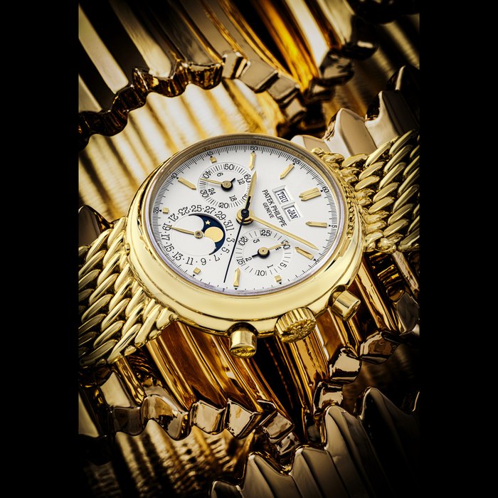 PATEK PHILIPPE. AN ATTRACTIVE 18K GOLD PERPETUAL CALENDAR CHRONOGRAPH BRACELET WATCH WITH MOON PHASES, 24 HOURS AND LEAP YEAR INDICATION REF. 3970/2, THIRD SERIES, CIRCA 1992