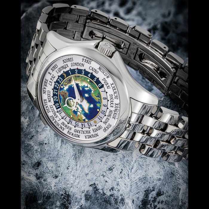 PATEK PHILIPPE. A PLATINUM AUTOMATIC WORLD TIME WRISTWATCH WITH CLOISONNÉ ENAMEL DIAL AND BRACELET REF. 5131/1P-001, CIRCA 2021