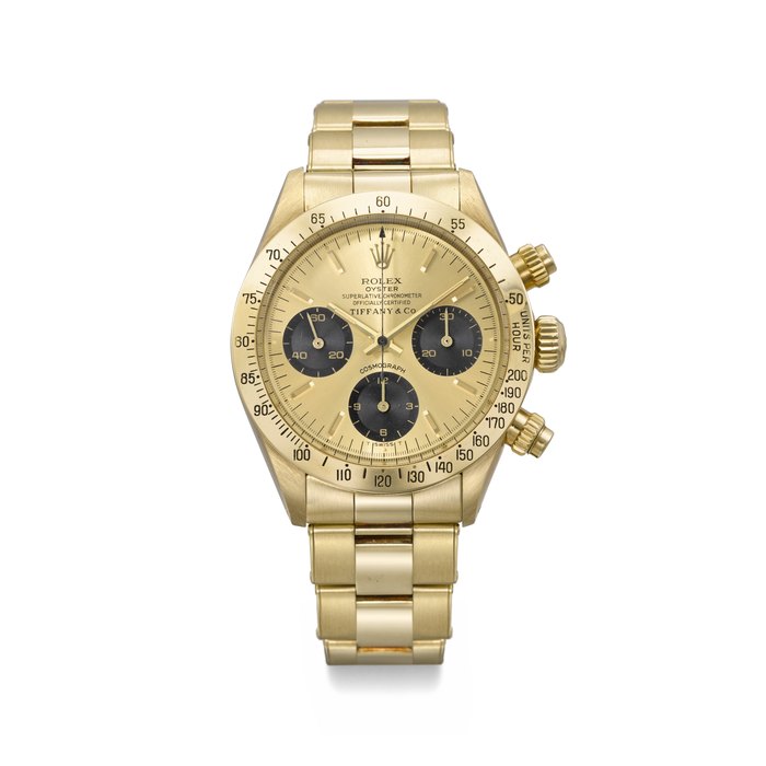 ROLEX. AN IMPORTANT AND EXTREMELY WELL PRESERVED 14K GOLD CHRONOGRAPH WRISTWATCH WITH BRACELET SIGNED ROLEX, RETAILED BY TIFFANY & CO., DAYTONA MODEL, REF. 6265, CASE NO. 5'060'443, CIRCA 1978