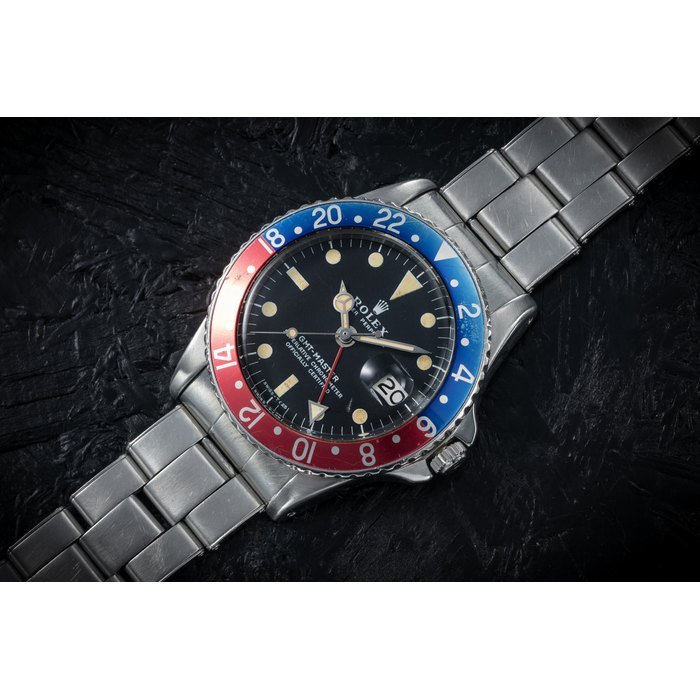 Rolex ROLEX, GMT-MASTER REF. 1675, A STEEL AUTOMATIC DUAL TIME WRISTWATCH CASE NUMBER: 621’850, MOVEMENT NUMBER: 55’180 · 1675