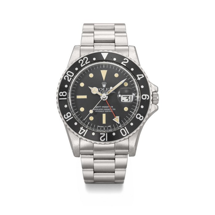 Rolex ROLEX. A RARE AND ATTRACTIVE STAINLESS STEEL AUTOMATIC DUAL-TIME WRISTWATCH WITH SWEEP CENTRE SECONDS, DATE, 'RADIAL' DIAL AND BRACELET SIGNED ROLEX, GMT-MASTER MODEL, REF.1675, CASE NO. 4'013'752, CIRCA 1975 · 1675