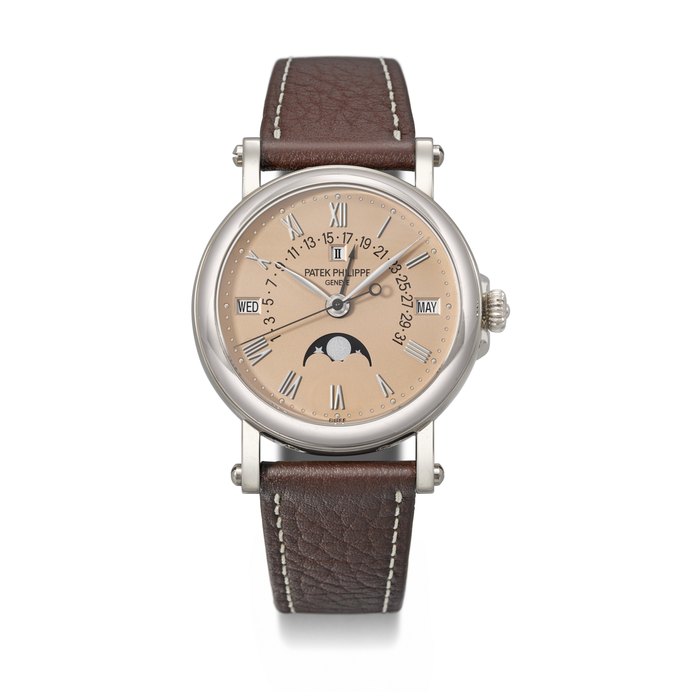 PATEK PHILIPPE. AN EXCEEDINGLY RARE AND IMPORTANT 18K WHITE GOLD AUTOMATIC PERPETUAL CALENDAR WRISTWATCH WITH SWEEP CENTRE SECONDS, RETROGRADE DATE, MOON PHASES, LEAP YEAR INDICATION AND ROSE DIAL SIGNED PATEK PHILIPPE, REF. 5059G-018, MOVEMENT NO. 3'410'746, CASE NO. 4'354'730, CIRCA 2015