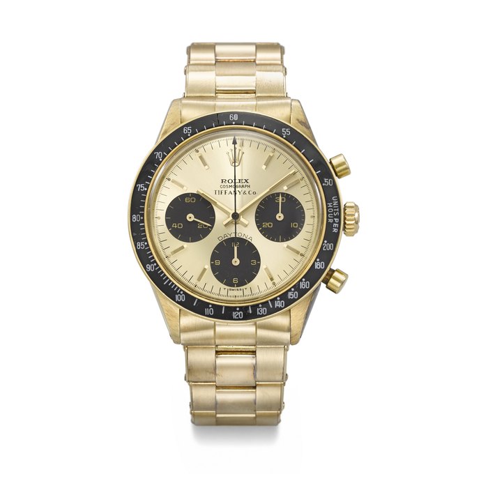 ROLEX. AN EXTREMELY RARE AND CHARMING 14K GOLD CHRONOGRAPH WRISTWATCH WITH TOBACCO BROWN 'TROPICAL' REGISTERS AND BRACELET SIGNED ROLEX, RETAILED BY TIFFANY & CO., DAYTONA MODEL, REF. 6264, CASE NO. 2'802'738, CIRCA 1971