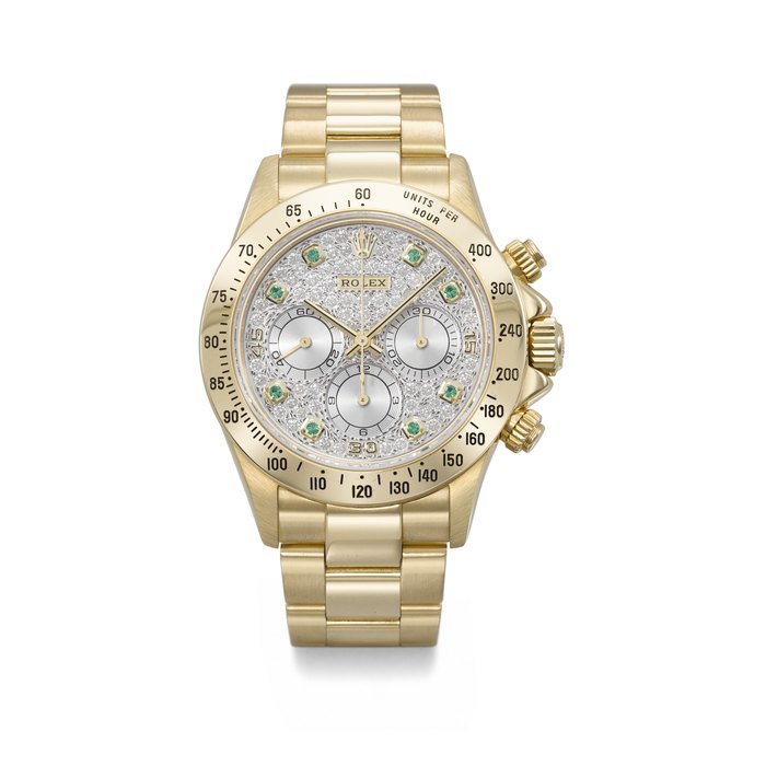 Rolex ROLEX. A VERY RARE AND IMPRESSIVE 18K GOLD, DIAMOND AND EMERALD-SET AUTOMATIC CHRONOGRAPH WRISTWATCH WITH BRACELET SIGNED ROLEX, DAYTONA MODEL, REF. 16528, CASE NO. S414449, CIRCA 1994 · 16528