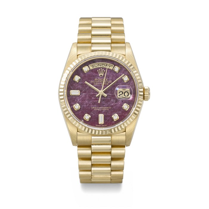 ROLEX. A RARE AND ATTRACTIVE 18K GOLD AND DIAMOND-SET AUTOMATIC WRISTWATCH WITH SWEEP CENTRE SECONDS, DAY, DATE, GROSSULAR GARNET RUBELLITE DIAL AND BRACELET SIGNED ROLEX, DAY-DATE MODEL, REF. 18238, CASE NO. L394656, CIRCA 1989