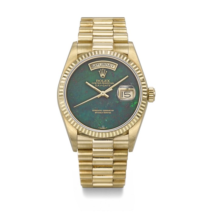 ROLEX. A RARE AND ATTRACTIVE 18K GOLD AUTOMATIC WRISTWATCH WITH SWEEP CENTRE SECONDS, DAY, DATE, GREEN BLOODSTONE DIAL AND BRACELET SIGNED ROLEX, DAY-DATE MODEL, REF. 18038, CASE NO. 9'166'159, CIRCA 1986