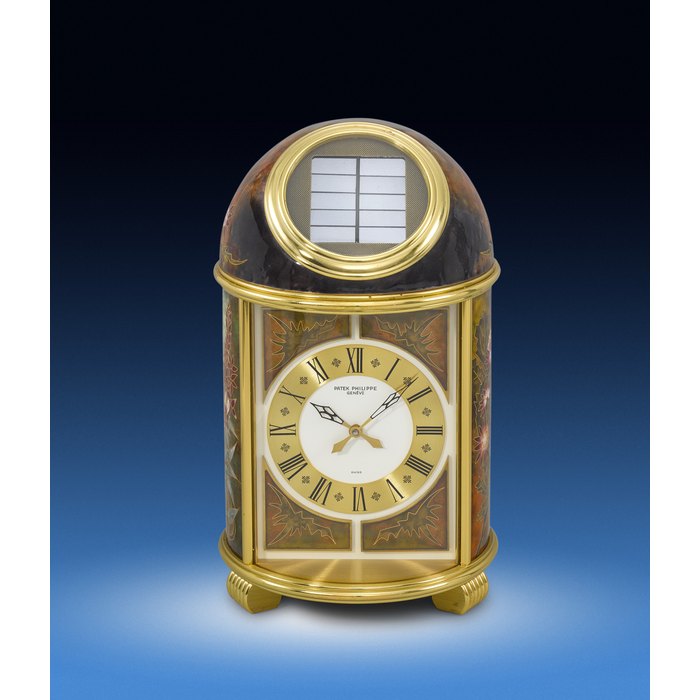 PATEK PHILIPPE. A UNIQUE AND HIGHLY ATTRACTIVE GILT BRASS SOLAR-POWERED DOME TABLE CLOCK WITH 'LIBELLULES' CLOISONNÉ ENAMEL DECORATION SIGNED PATEK PHILIPPE, 'LIBELLULES' DOME CLOCK, REF. 1364, MOVEMENT NO. 1’804'692, CIRCA 1990