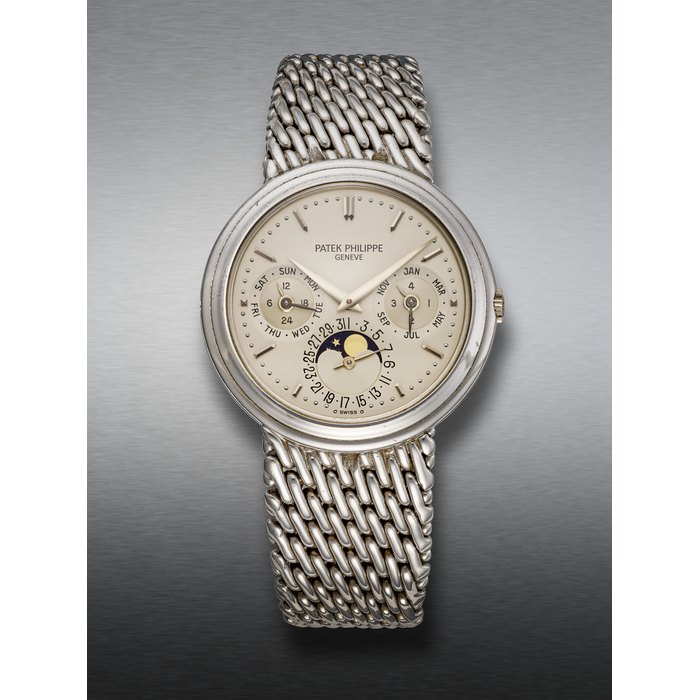 PATEK PHILIPPE, EXTREMELY RARE WHITE GOLD PERPETUAL CALENDAR WRISTWATCH, WITH MOON PHASES, REF. 3945/1
