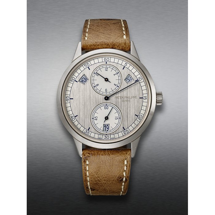 PATEK PHILIPPE, WHITE GOLD ANNUAL CALENDAR WRISTWATCH, WITH REGULATOR-STYLE DIAL, REF. 5235G-001