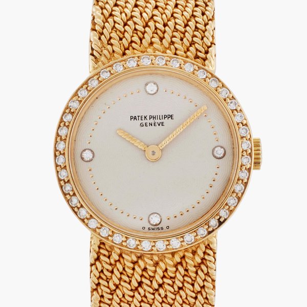 Patek Philippe Reference 4522/1 | A yellow gold and diamond-set bracelet watch, Circa 1980