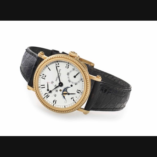 Patek Philippe. A Fine 18k Gold Automatic Wristwatch with Power Reserve and Moon Phases SIGNED PATEK PHILIPPE, GENEVE, REF. 5015, MOVEMENT NO. 1'959'969, CASE NO. 2'975'528, MANUFACTURED IN 1995