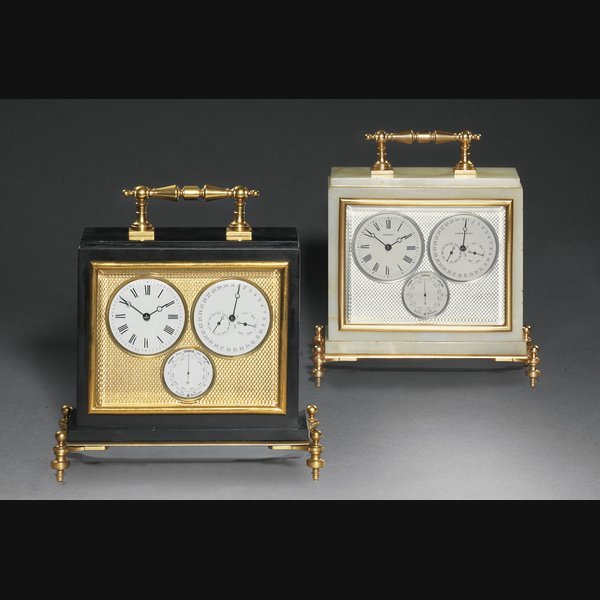  A matched pair of French eight day calendrical timepieces in black marble and pale onyx RETAILED BY MASON, CANTERBURY. CIRCA 1880