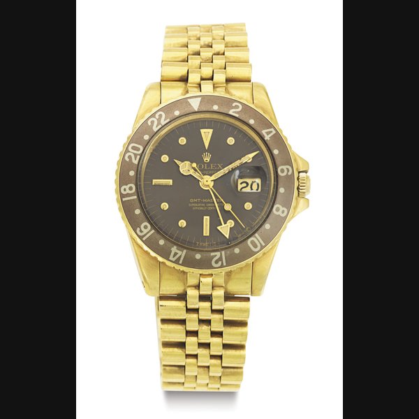 ROLEX. AN 18K GOLD AUTOMATIC DUAL TIME ZONE WRISTWATCH WITH DATE, 24 HOUR INDICATION, CENTER SECONDS AND BRACELET SIGNED ROLEX, OYSTER PERPETUAL, GMT-MASTER, MOVEMENT NO. D100271, CASE NO. 1851423, REF. 7675, CIRCA 1969