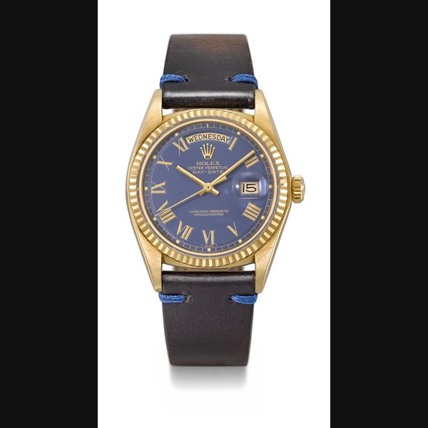 ROLEX. A VERY FINE 18K GOLD AUTOMATIC WRISTWATCH WITH SWEEP CENTRE SECONDS, DAY, DATE AND BLUE DIAL WITH GILT ROMAN NUMERALS SIGNED ROLEX, OYSTER PERPETUAL, DAY-DATE, REF. 1803, CASE NO. 4’159’641, CIRCA 1976