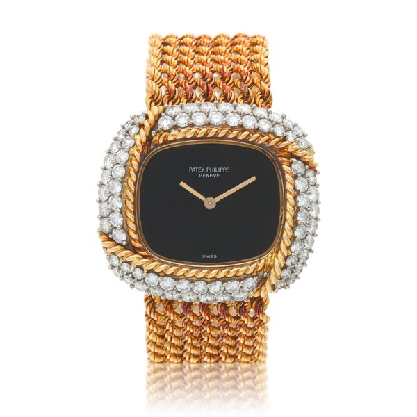 Patek Philippe Reference 4336, A yellow gold and diamond-set cushion shaped bracelet watch, Circa 1980