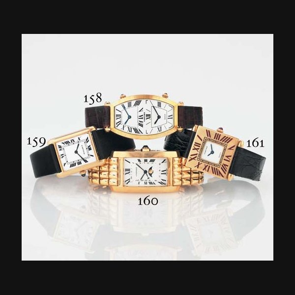 CARTIER. AN 18K GOLD TONNEAU DUAL TIME ZONE WRISTWATCH SIGNED CARTIER, PARIS, NO. A104750, CIRCA 1989