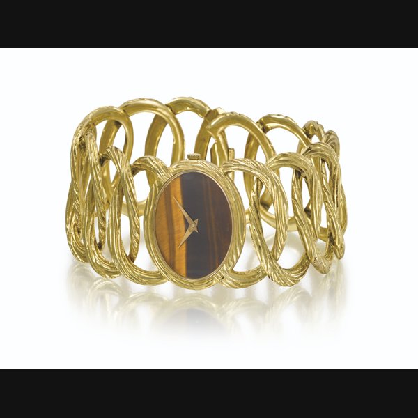 PIAGET. AN ELEGANT 18K GOLD BRACELET WATCH WITH TIGER'S EYE DIAL SIGNED PIAGET, REF. 9852 D 65, CASE NO. 173'909, MANUFACTURED IN 1969