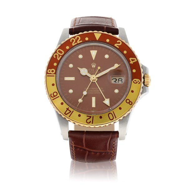 Rolex Rolex | GMT-Master "Rootbeer", Reference 1675, A yellow gold and stainless steel dual time zone wristwatch with date, Circa 1972 | 勞力士 | GMT-Master "Rootbeer" 型號1675   黃金及精鋼兩地時間鏈帶腕錶，備日期顯示，約1972年製 · 1675