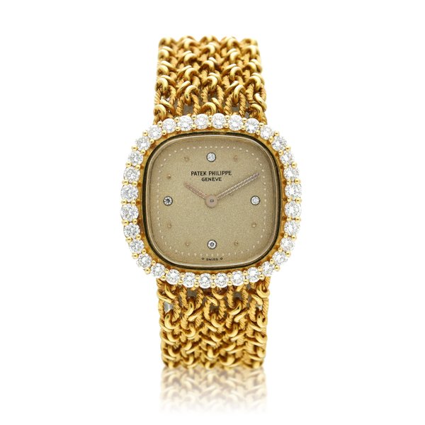 Patek Philippe Reference 4524/1  A yellow gold and diamond-set cushion shaped wristwatch, Circa 1982