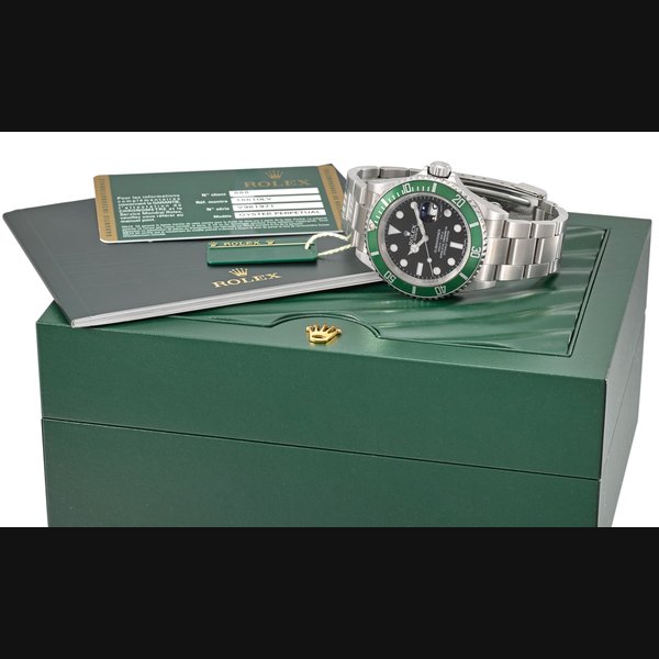 Rolex. An attractive stainless steel automatic wristwatch with sweep centre seconds, date, green bezel, bracelet, original guarantee and box Signed Rolex, Oyster Perpetual Date, Submariner, 1000ft=300m, Ref. 16610LV, case no. V981972, circa 2009