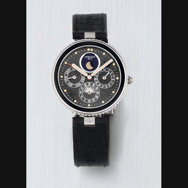 Gerald Genta. An 18ct White Gold Quartz Calendar Wristwatch with Alarm SIGNED GERALD GENTA, GEFICA, PIECE NO 274,CASE NO 33811. CIRCA 1995