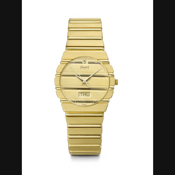 PIAGET. AN ATTRACTIVE 18K GOLD QUARTZ WRISTWATCH WITH DAY, DATE AND BRACELET POLO MODEL, REF. 15562 C 701, CASE NO. 431'907, MANUFACTURED IN 1984