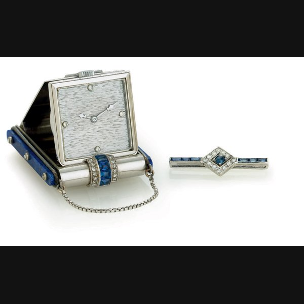 VACHERON CONSTANTIN. AN 18K WHITE GOLD, DIAMOND, SAPPHIRE AND LAPIS LAZULI TRAVEL WATCH SIGNED VACHERON CONSTANTIN, RETAILED BY CARTIER, MOVEMENT NO. 412865, CASE NO. 12597, MANUFACTURED IN 1930