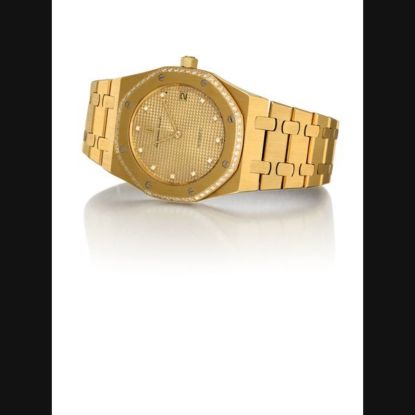 Audemars Piguet AUDEMARS PIGUET. A FINE 18K GOLD AND DIAMOND-SET AUTOMATIC BRACELET WATCH WITH DATE SIGNED AUDEMARS PIGUET, AUTOMATIC, ROYAL OAK MODEL, NO. 637, CIRCA 1985