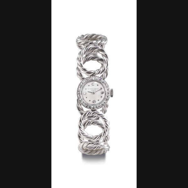Vacheron Constantin VACHERON CONSTANTIN. A LADY'S PLATINUM AND DIAMOND WRISTWATCH WITH ASSOCIATED 18K WHITE GOLD LINK BRACELET SIGNED VACHERON CONSTANTIN, GENEVE, MOVEMENT NO. 470808, CASE NO. 310119, REF. 4509, MANUFACTURED IN 1949