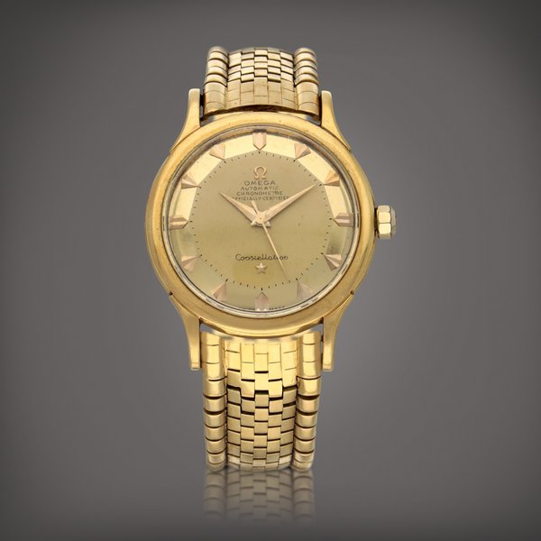Omega Constellation, Reference 2699 SC | A yellow gold wristwatch with bracelet | Circa 1955
