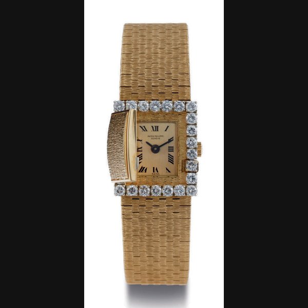 PATEK PHILIPPE. A LADY'S 18K GOLD AND DIAMOND WRISTWATCH WITH CONCEALED DIAL AND BRACELET SIGNED PATEK PHLIPPE, GENEVA, MOVEMENT NO. 988184, CASE NO. 2650722, REF. 3319/3367, CIRCA 1966