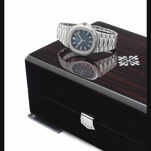 Patek Philippe. A Fine and Large Stainless Steel Automatic Wristwatch with Date, Center Seconds, and Bracelet SIGNED PATEK PHILIPPE, GENÈVE, NAUTILUS MODEL, REF. 5711/1A, MOVEMENT NO. 5'689'807, CASE NO. 4'936'400, CIRCA 2012