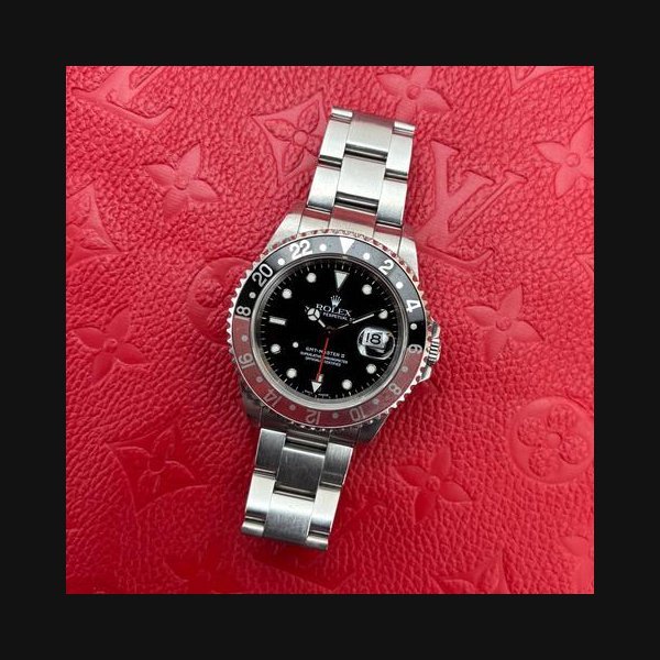 Rolex Rolex GMT-Master II40mm Coke Black Dial Circa 2000 Preowned Box & Papers