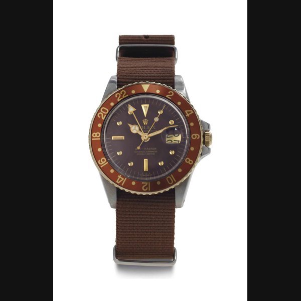 Rolex Rolex. A Stainless Steel And Gold Automatic Wristwatch With Date, Center Seconds, 24 Hours SIGNED ROLEX, OYSTER PERPETUAL, GMT-MASTER, REF. 1675, CASE NO. 5'735'659, CIRCA 1978 · 1675