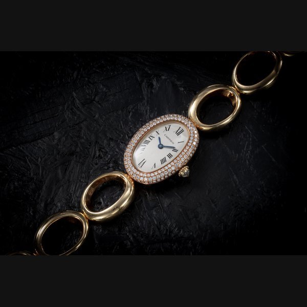 Cartier CARTIER, BAIGNOIRE REF.1967, AN ATTRACTIVE GOLD AND DIAMOND-SET BRACELET WATCH CASE NUMBER: D00’1019