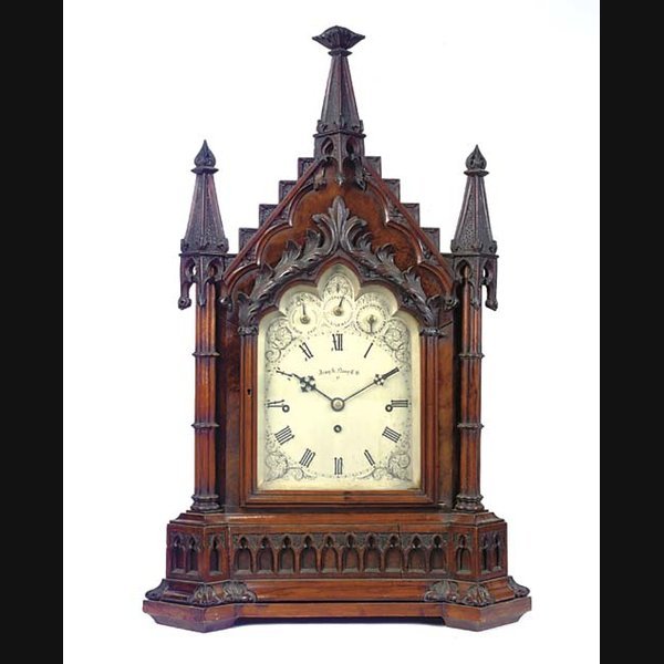 A Victorian walnut quarter-chiming table clock, circa 1880