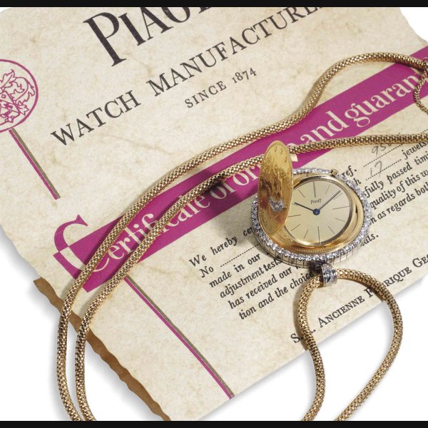 Piaget. A Fine 18k Gold Platinum And Diamond Coin Watch With Chain SIGNED PIAGET, REF. 950E, MOVEMENT NO. 590'818, CIRCA 1970