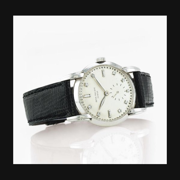 PATEK PHILIPPE. A FINE AND RARE PLATINUM AND DIAMOND WRISTWATCH WITH UNUSUAL LUGS SIGNED PATEK PHILIPPE, GENEVE, MOVEMENT NO. 956468, CASE NO. 422646, REF. 2429, MANUFACTURED IN 1951