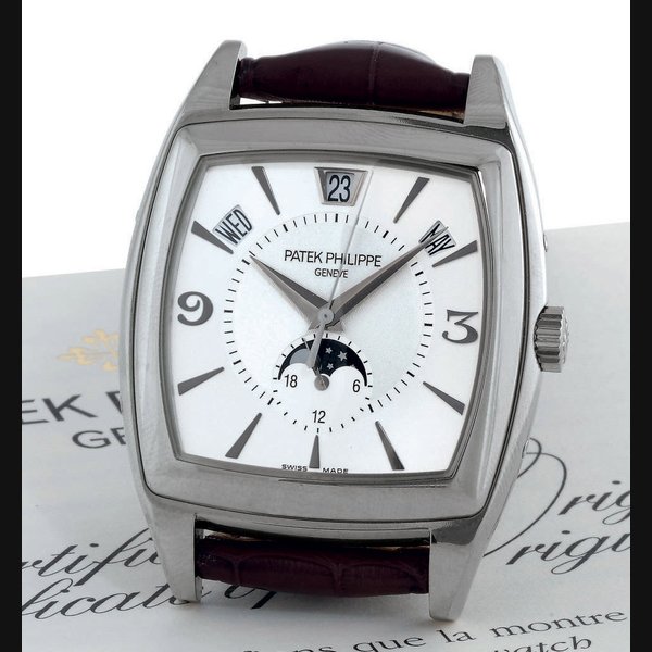 PATEK PHILIPPE. A FINE 18K WHITE GOLD AUTOMATIC ANNUAL CALENDAR WRISTWATCH WITH CENTER SECONDS AND MOON PHASES SIGNED PATEK PHILIPPE, GENEVA, GONDOLO CALENDARIO MODEL, MOVEMENT NO. 3426509, CASE NO. 4408445, REF. 5135, CIRCA 2007