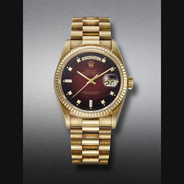 ROLEX, YELLOW GOLD AND DIAMOND-SET 'DAY-DATE', WITH RED VIGNETTE DIAL, REF. 18038