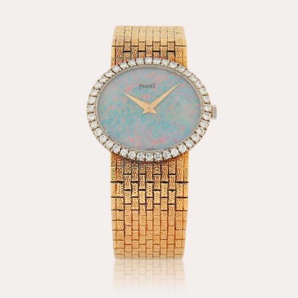 Piaget Reference 9806 H 5 | A yellow gold and diamond-set bracelet watch with opal dial | Circa 1970 · 9806