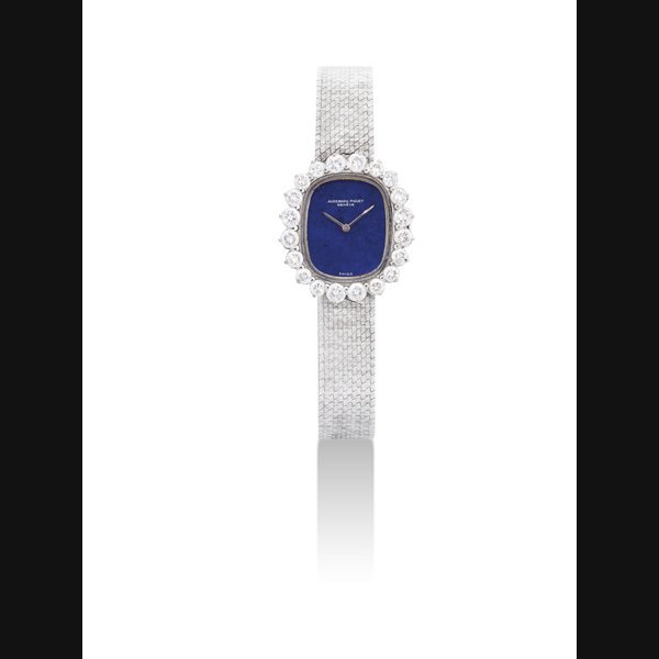 Audemars Piguet AUDEMARS PIGUET. A LADY'S 18K WHITE GOLD AND DIAMOND-SET CUSHION-SHAPED BRACELET WATCH WITH LAPIS LAZULI DIAL SIGNED AUDEMARS PIGUET, GENEVE, MOVEMENT NO. 117'909, CASE NO. 65'617, CIRCA 1975