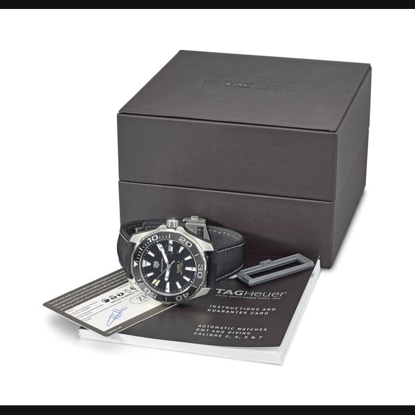 TAG HEUER. A STAINLESS STEEL AUTOMATIC WRISTWATCH WITH DATE, BRACELET, ORIGINAL GUARANTEE AND BOX SIGNED TAG HEUER, AQUARACER, CALIBRE 5, 300M / 1000FT, REF. WAY201A, CASE NO. RHB0464, CIRCA 2016