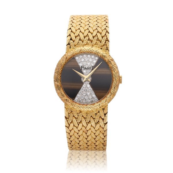 Piaget Reference 9040 | A yellow gold bracelet watch with diamond-set and tiger's eye dial, Circa 1980 · 9040