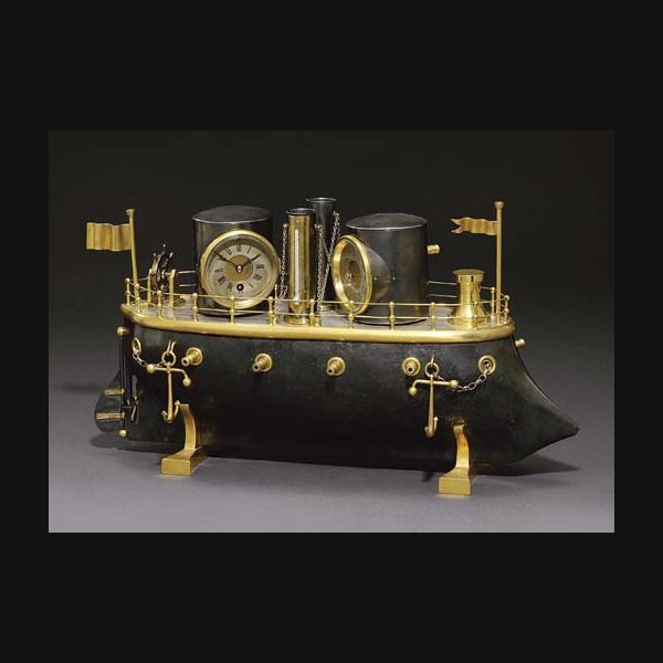 Iron-Clad Battleship A rare French gilt and silvered brass eight day timepiece with barometer, thermometer and automaton gun turrets and propeller CIRCA 1890
