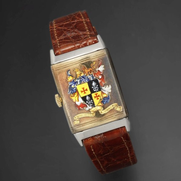 Jaeger-LeCoultre. A steel and 9K gold manual wind reversible wristwatch with painted coat of arms Reverso, Case No.4065, Movement No.16012, London Import mark for 1935