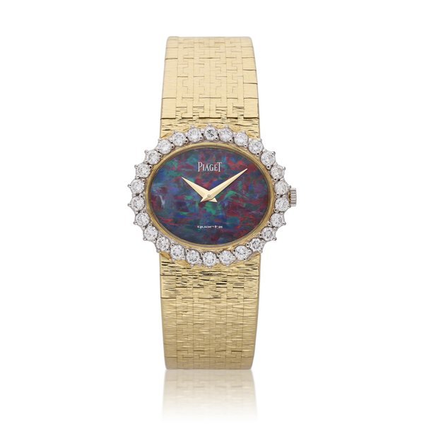 Piaget Reference 9326 | A yellow gold and diamond set bracelet watch with opal dial, Circa 1980 · 9326