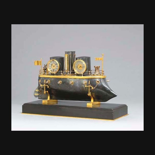 A Rare French Bronze Patinated A rare French bronze patinated, ormolu and black marble automaton early iron-clad battleship clock CIRCA 1880